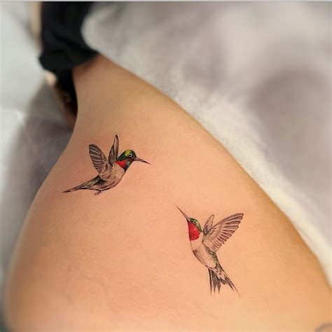 Jul 26, 2023 A black and white hummingbird clutching a flower in its beak, inked on the shoulder blade, is a stunningly elegant design. . Dainty hummingbird tattoo